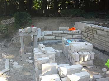 Landscape construction photo of the natural stone retaining wall