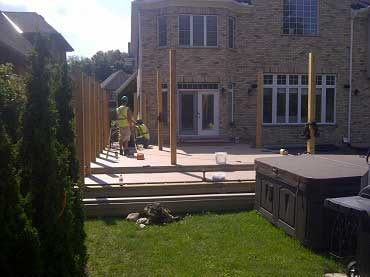 Landscape construction photo of the deck and pergola posts
